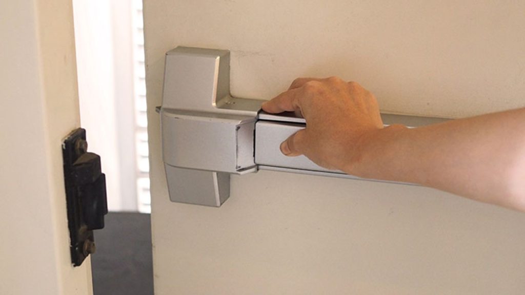 How often should you ensure that bolts, padlocks and security devices are removed from fire exits?