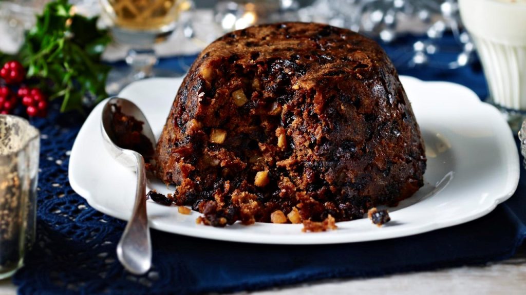 What is traditionally hidden inside a christmas pudding?