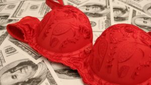 Name something a woman might keep in her bra